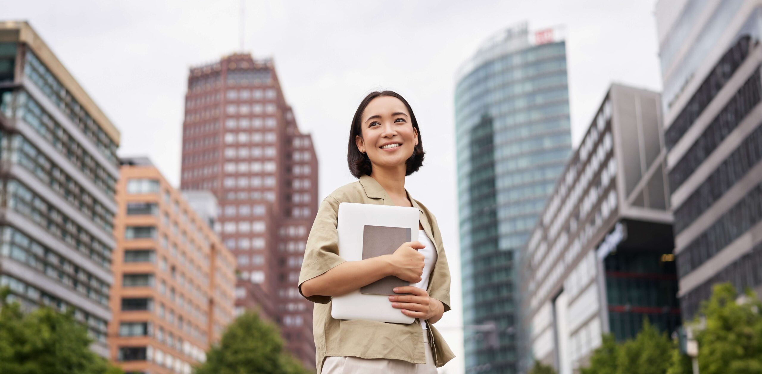 portrait-young-asian-woman-looking-happy-confident-going-work-university-city (1) work abroad without the local languages