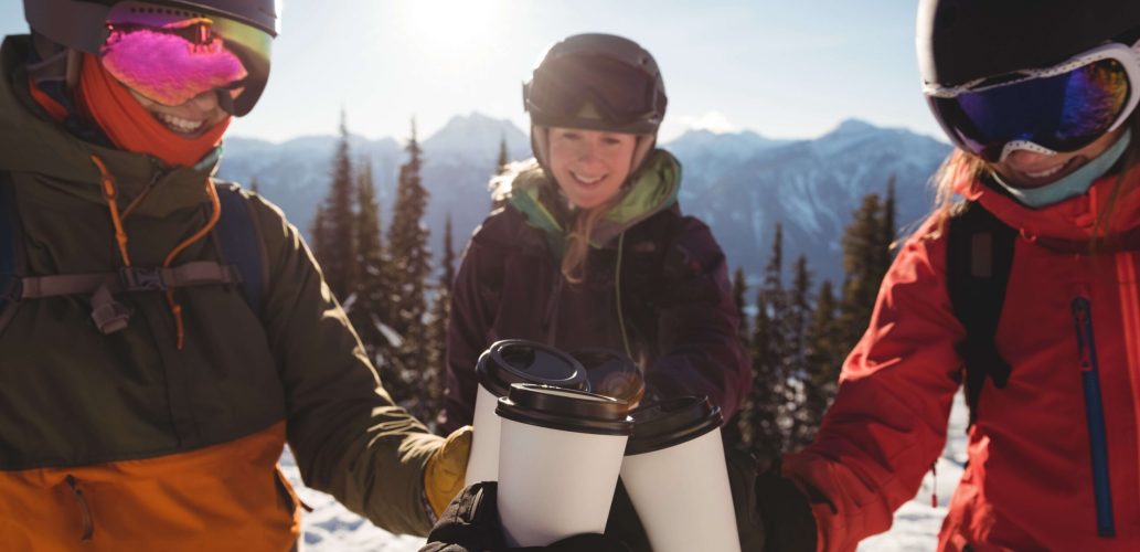 skiers-toasting-cup-coffees-snow-covered-mountain (1)