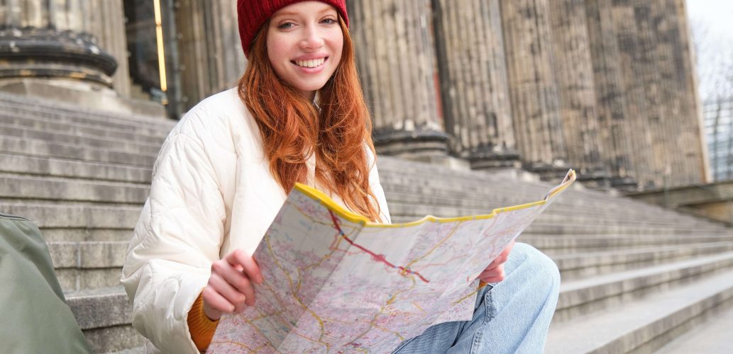 tourism-lifestyle-concept-young-redhead-woman-looking-city-map-plans-route-sightseeing (1)